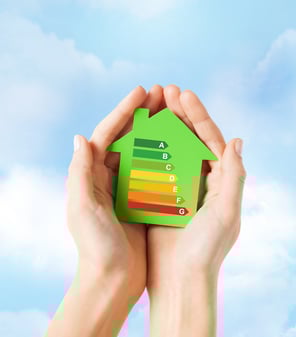energy-saving-real-estate-family-home-concept-closeup-female-hands-holding-green-paper-house-with-energy-efficiency-rating
